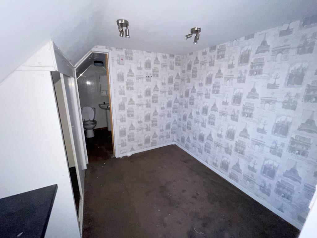 Lot: 75 - FLAT FOR IMPROVEMENT/COMPLETION - Room leading to shower room with W.C.